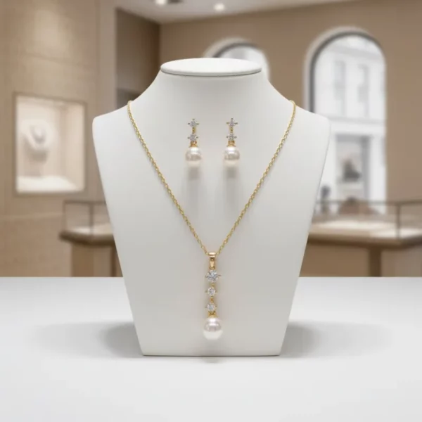 7310 Dainty Pearl Necklace Set - Athena with gold finish, simulated ivory pearls, clear cubic zirconia crystals and matching earrings. on display 2