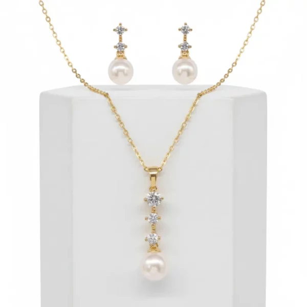 7310 Dainty Pearl Necklace Set - Athena with gold finish, simulated ivory pearls, clear cubic zirconia crystals and matching earrings. on display 2