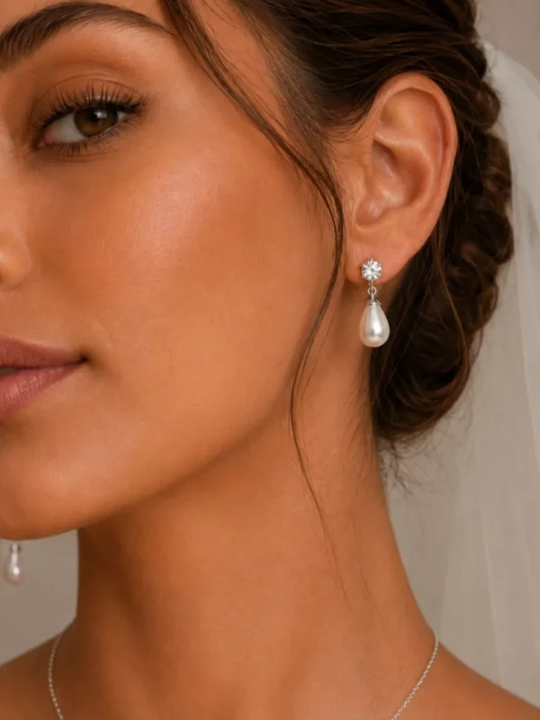 1905 Timeless Elegance Necklace Set - Athena with cubic zirconia crystals, oval simulated ivory pearl drops and matching earrings. close up earring
