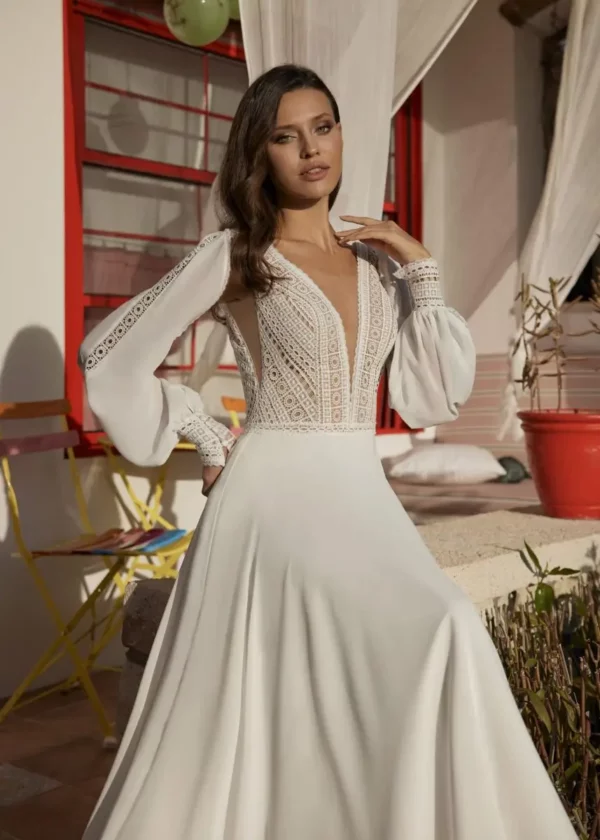 Ariane GBS Herve Paris boho A-line wedding dress front view with crochet lace bodice and detachable bishop sleeves front