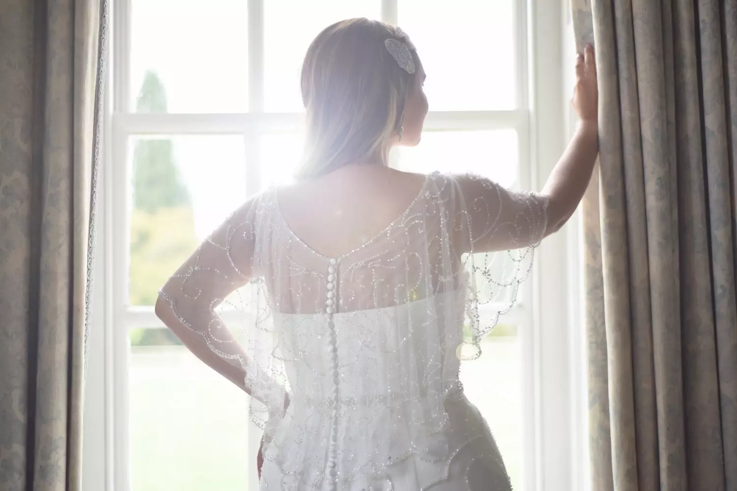 True Curves Blythe TC-W310A back view with flowing beaded cape and button closure