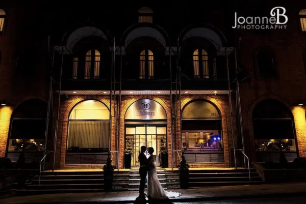 Joanne B Wedding Photography couple out side venue at night