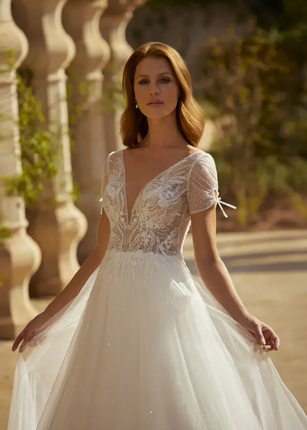 Caylee GBS Herve Paris glitter tulle A-line wedding dress front view with deep V-neckline and lace bodice front detail