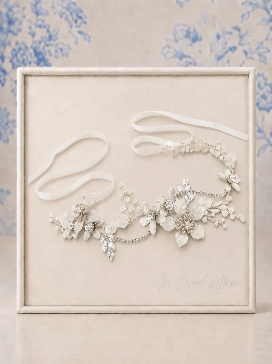 Athena 1812 Exquisite Romance Vine Silver displayed on ivory satin frame.