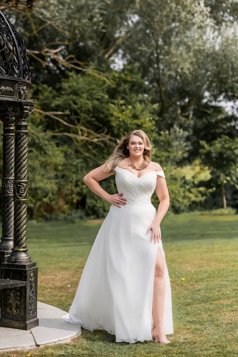 Envy by Phoenix Eden PH8246 front view featuring off-the-shoulder pleated bodice, chiffon skirt,