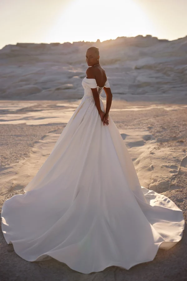 Back view of Eva Lendel Chabli wedding dress with lace-up corset and sweeping satin train