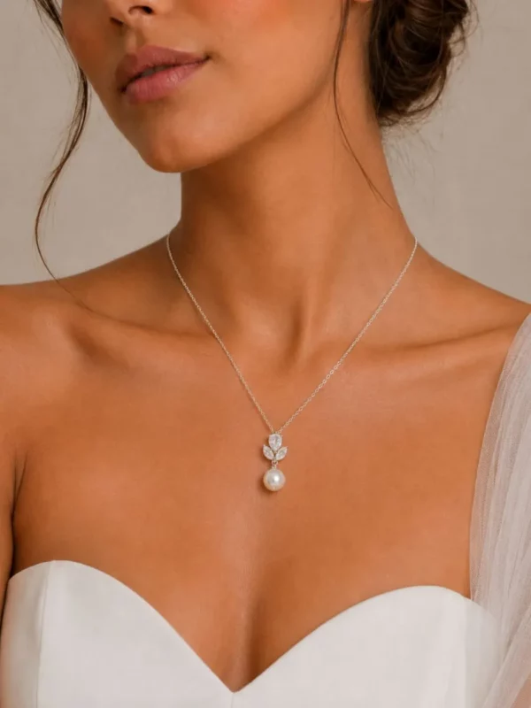 9926 Vintage Shimmer Necklace - Athena vintage pearl and crystal bridal necklace with simulated ivory pearls and cubic zirconia crystals close up on bride