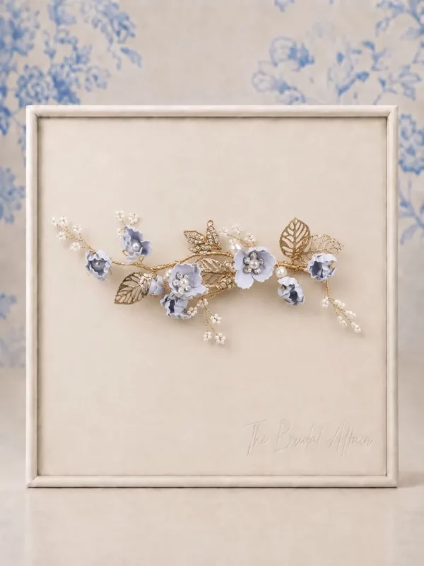 PBH7065 Blue Flower Bridal Hair Comb displayed on ivory satin frame.