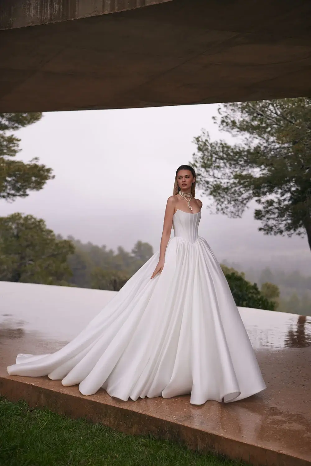 Eva Lendel Lake wedding dress &ndash; strapless satin ball gown with pleated full skirt and cathedral train
