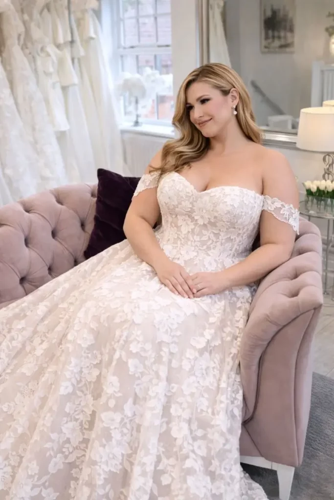 Bride seated in her wedding dress in the boutique at The Bridal Affair & Curvy Bridal