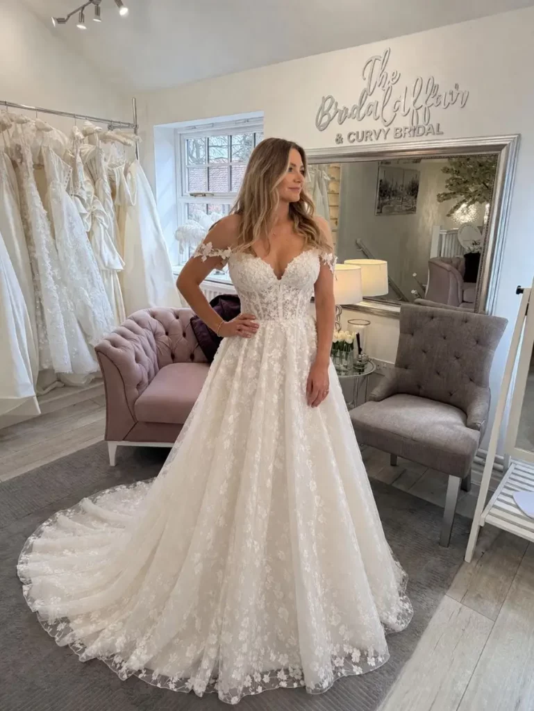 Full-length bridal portrait in a lace wedding dress at The Bridal Affair & Curvy Bridal