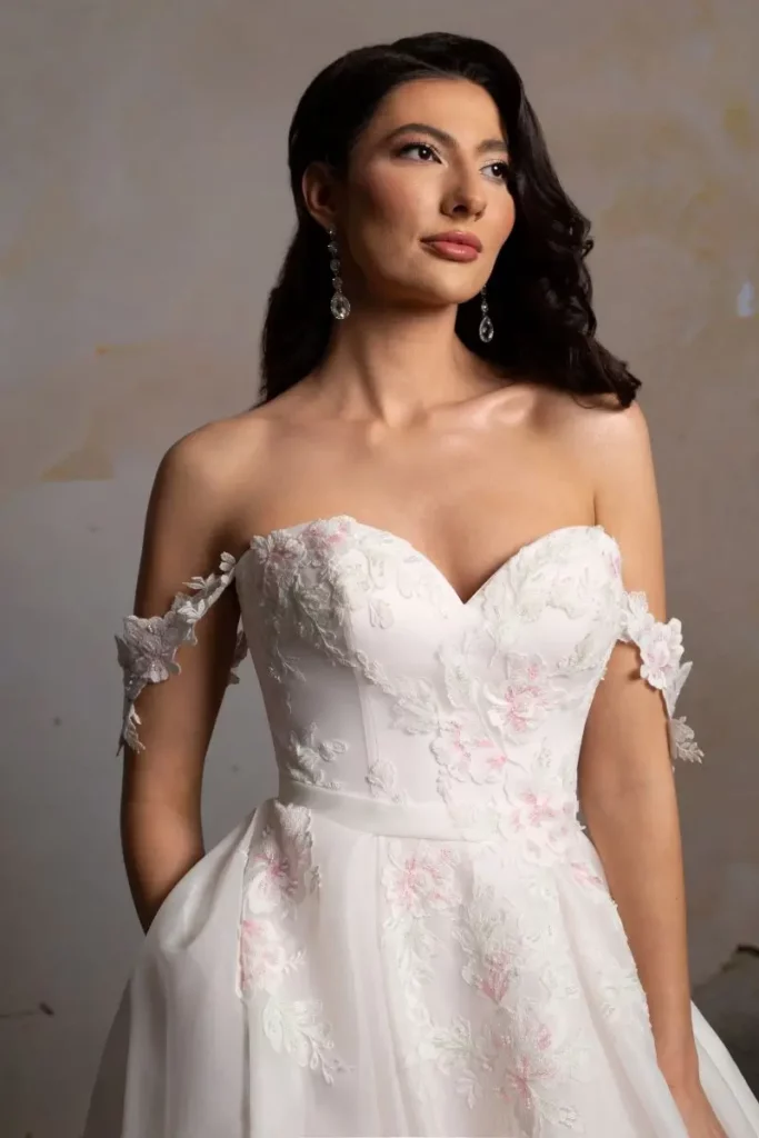 Close-up of 3D floral applique on a wedding dress bodice