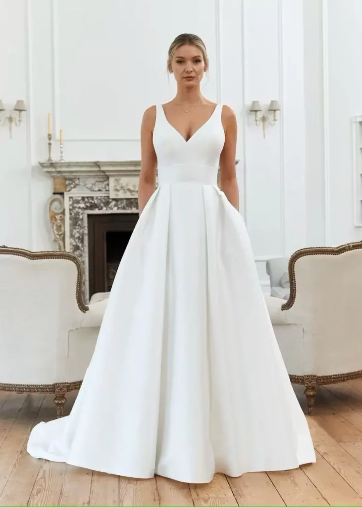 Minimalist wedding dress with clean structured skirt and smooth fabric