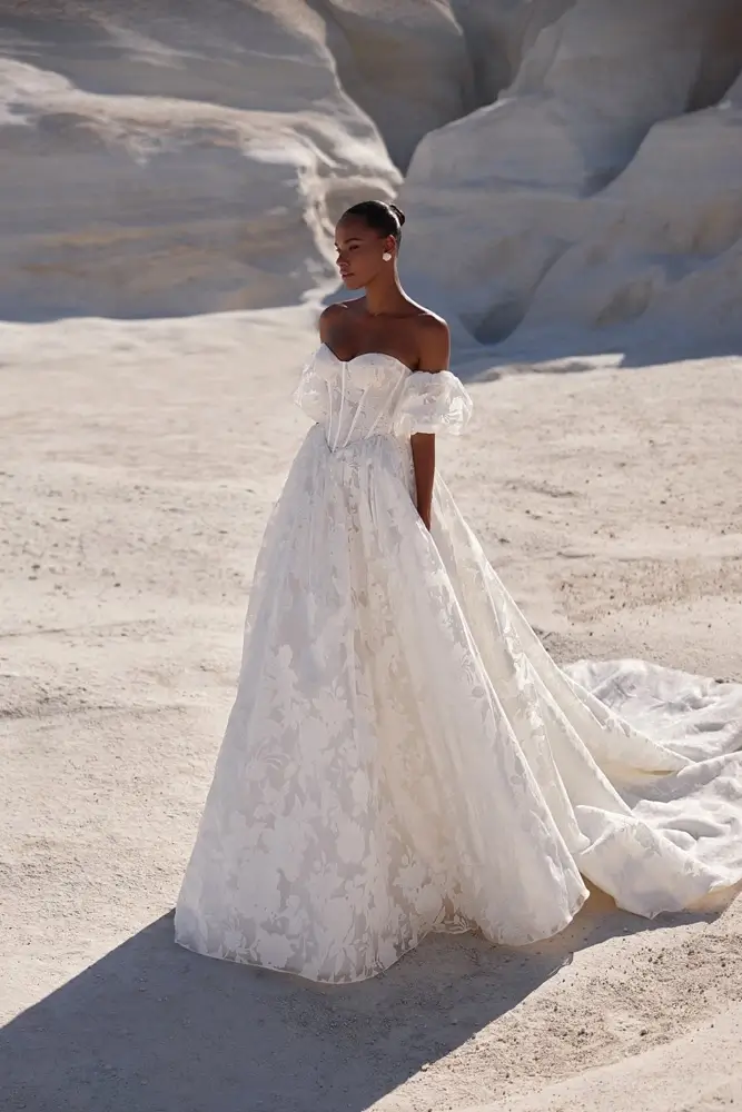 Wedding dress with textured floral fabric and statement off-the-shoulder sleeves