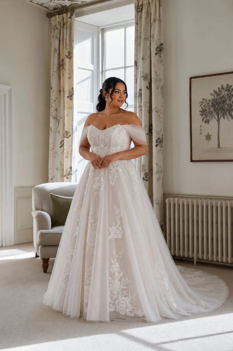 Wilda by Romantica of Devon Curve floral A-line wedding dress with sweetheart neckline and off-the-shoulder tulle sleeves