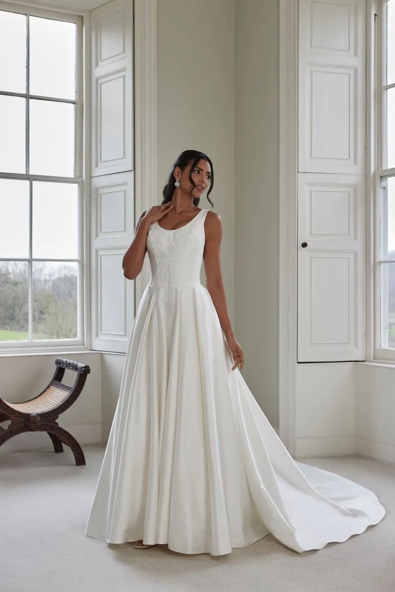 Georgette by Romantica of Devon satin A-line wedding dress with embroidered bodice and flowing train