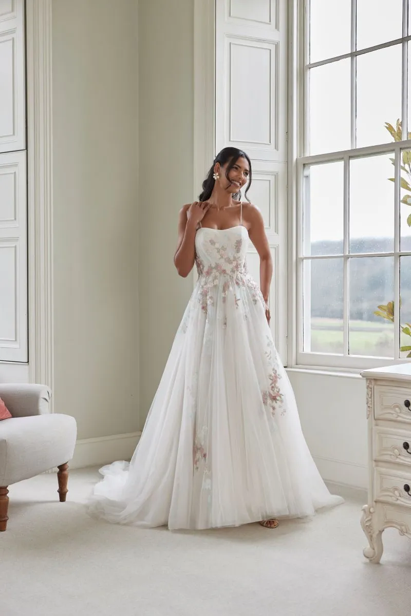 Susan by Romantica of Devon wedding dress with pastel floral appliqu&eacute;s, delicate straps and flowing tulle skirt