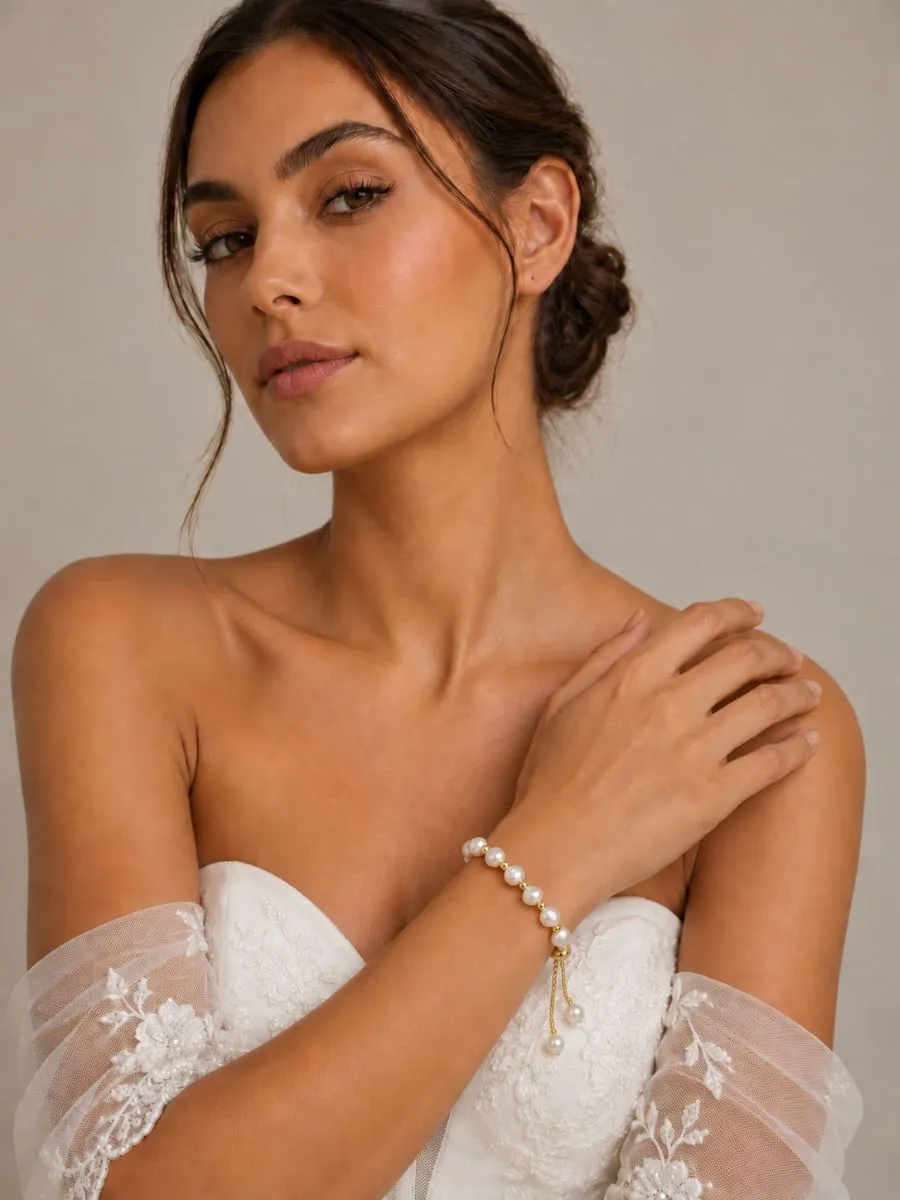 Bride wearing Athena 3465 adjustable baroque pearl bracelet with gold detailing