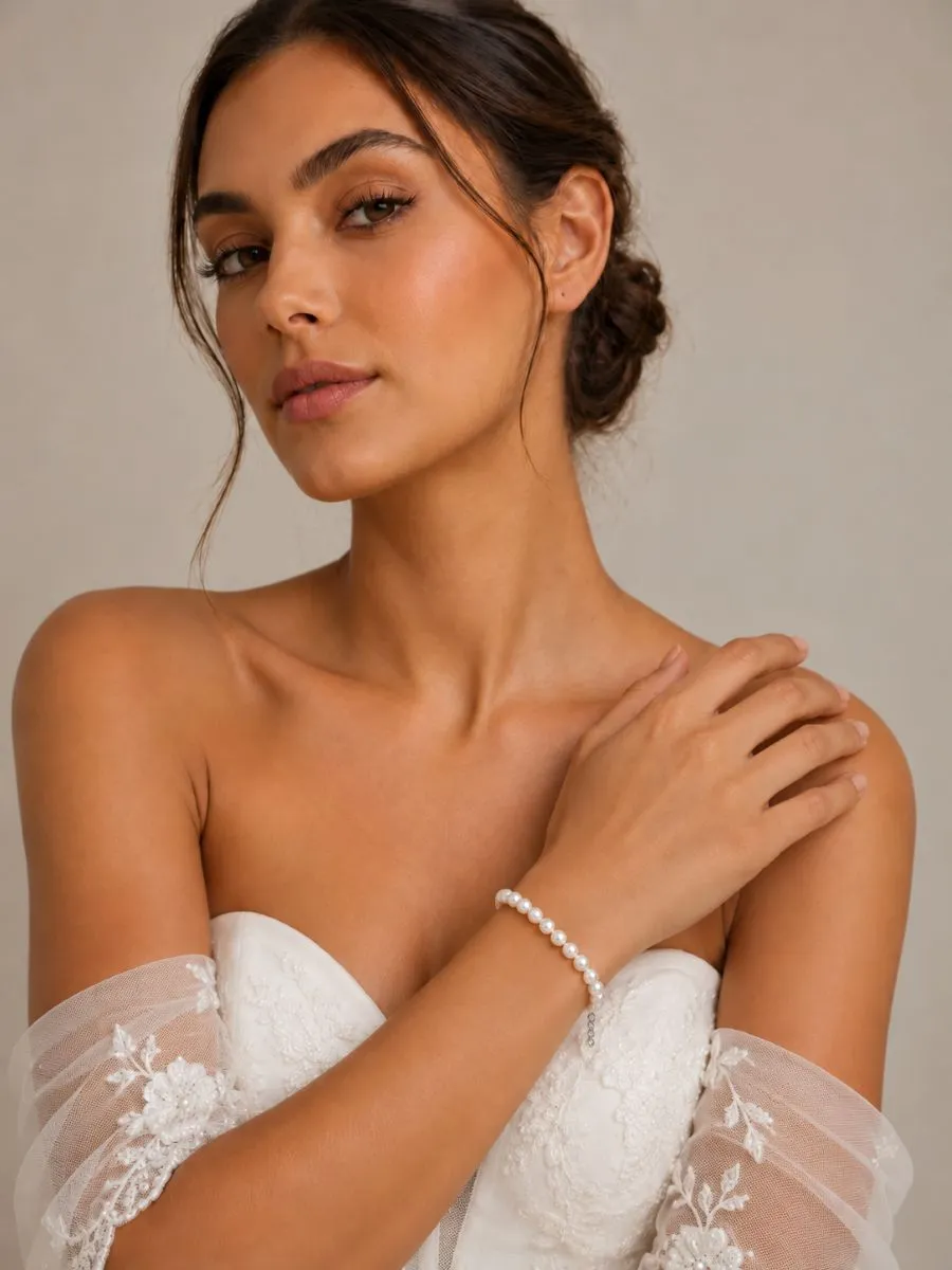 Bride wearing Athena 9390 classic ivory pearl bracelet with wedding dress
