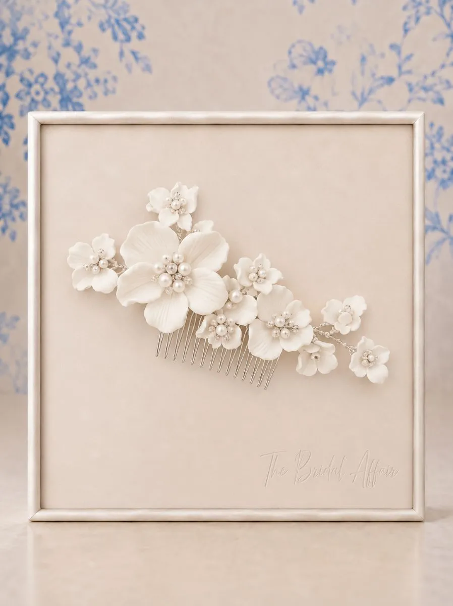 Athena 9585 ivory floral bridal hair comb with ceramic flowers and pearl detailing on display board
