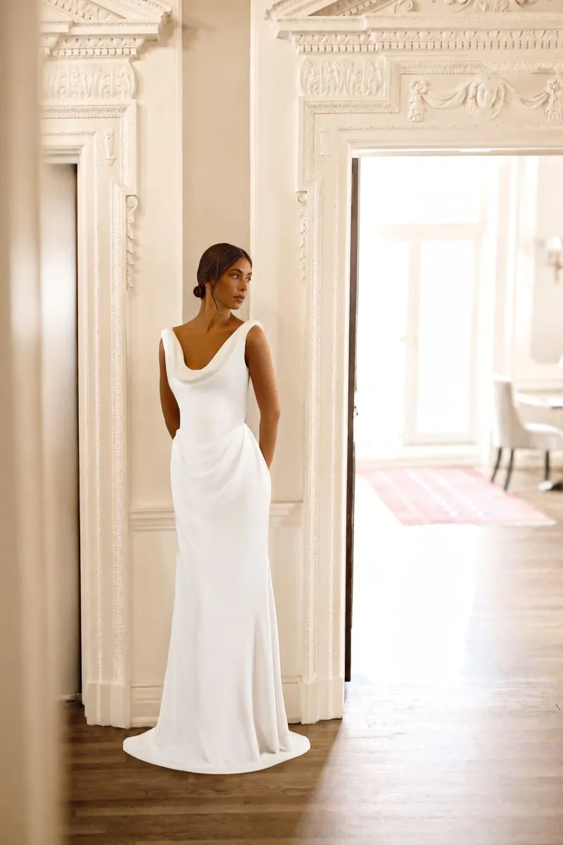 Eleri by Phoenix Gowns 1920s-inspired crepe wedding dress with draped cowl neckline, fitted silhouette and elegant high-kick train.