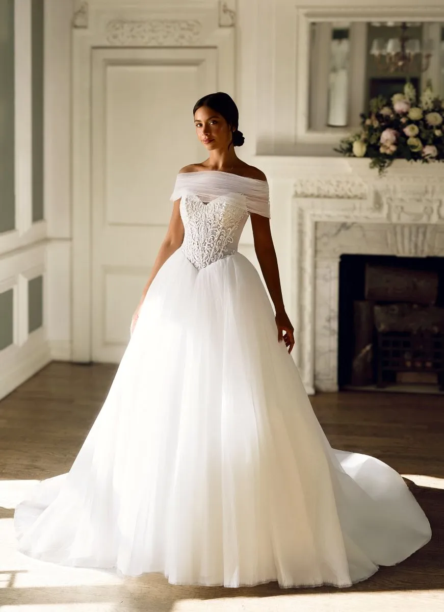 Evadne by Phoenix Gowns, romantic ballgown wedding dress with hand-beaded lace basque bodice, off-the-shoulder cuffs and full soft tulle skirt.