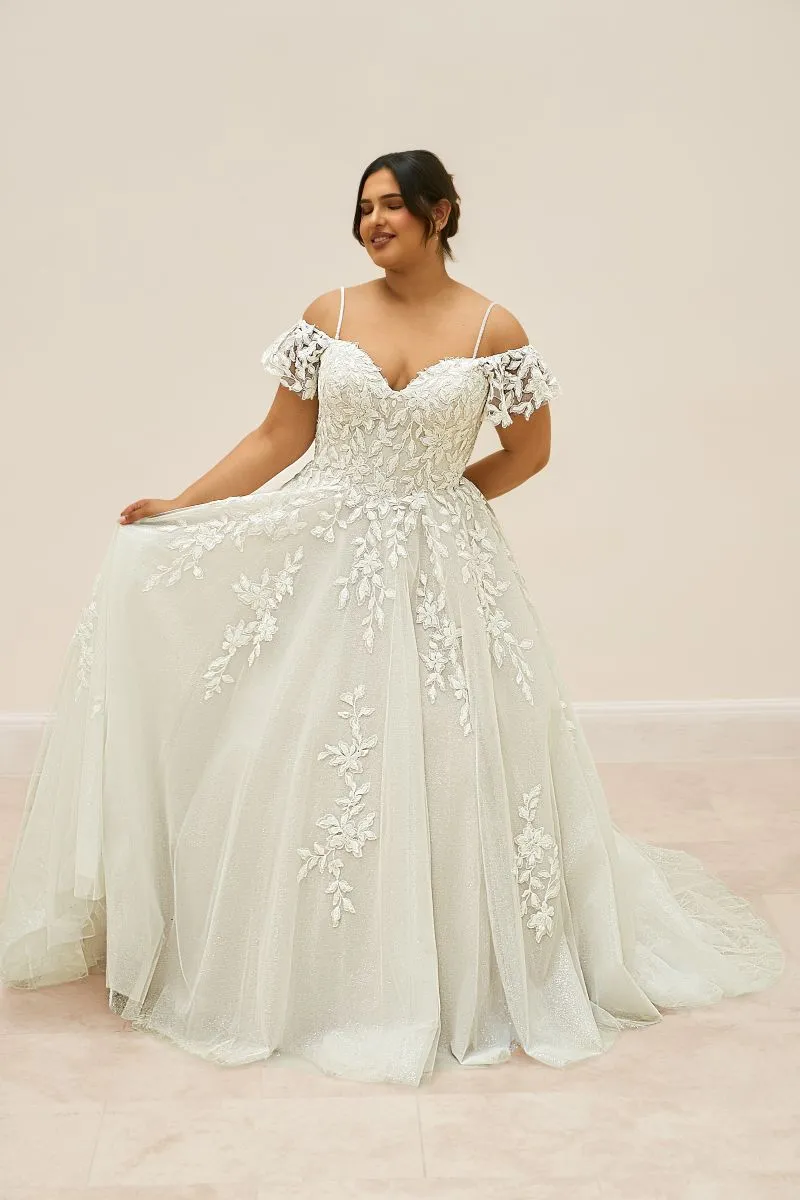 Full-length front view of Edena by Envy by Phoenix Gowns in Sand/Ivory with a romantic A-line tulle skirt and floral lace detailing.